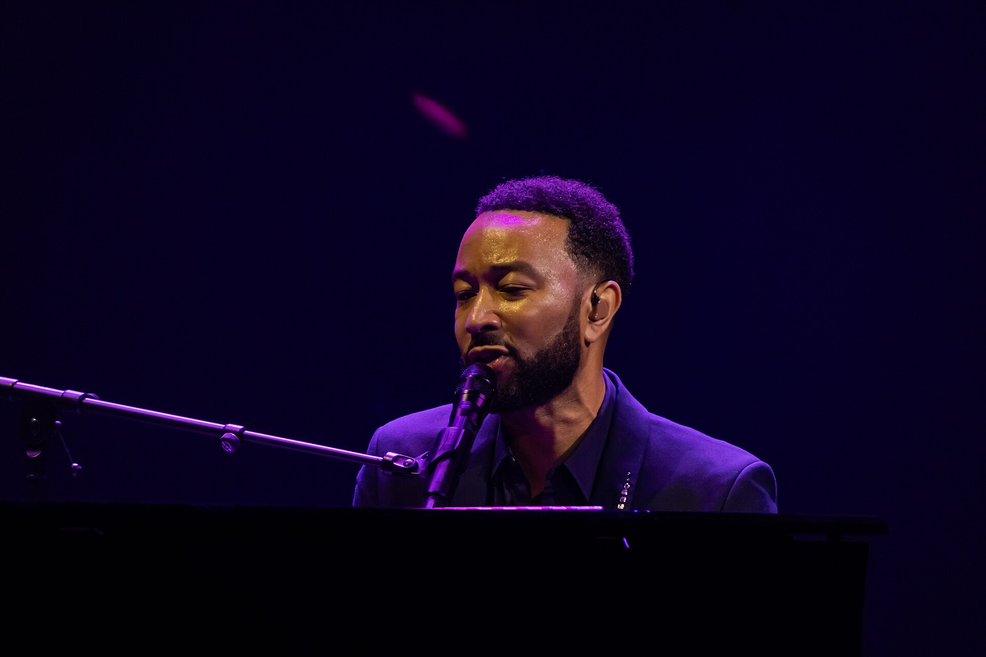 John Legend at the piano on stage at the Montreux Jazz Festival